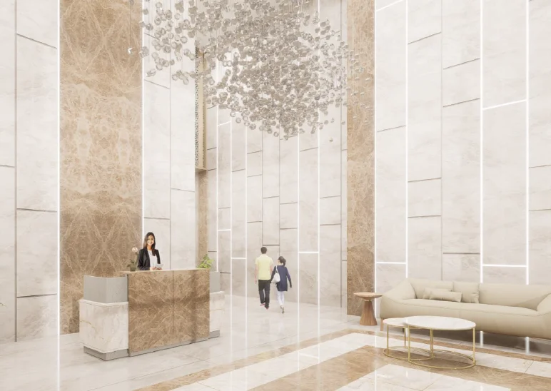 Lobby interior with sculpture and stone wall at Forbes Fab Luxe Residences